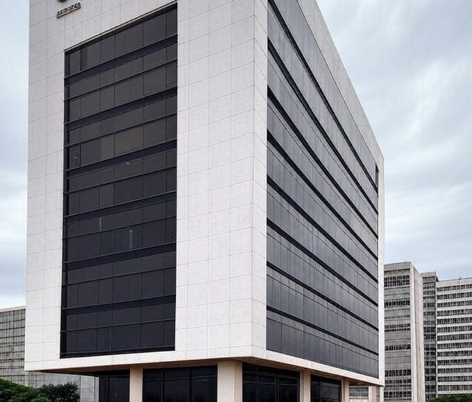 Prédio da Caesb em Brasília sob céu nublado, representando frustração com resultado provisório de concurso.
